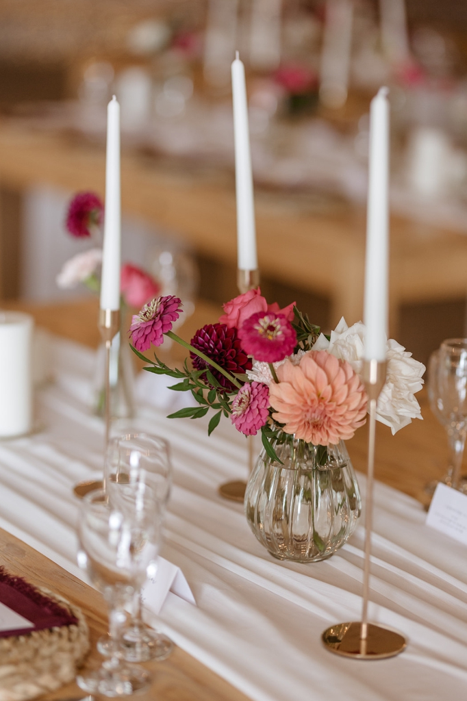 My Pretty Vintage in Paarl, Wedding Event Planners also offers beautiful Wedding Décor Hire. Minimalist Reception Guest Table Seating with Candles, Roses, Dahlias, scented Stock flowers Burgandy Purple Cream Blush.